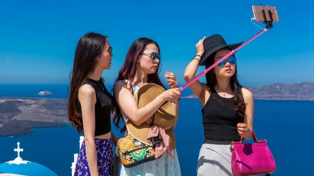 Chinese tourists in Santorini, Greece.