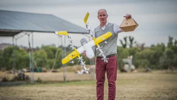Project Wing has been developing a technology drone delivery service for Tuggeranong, delivering hot meals and chemist supplies. Delivery project manager Luke Barrington takes delivery of a hot lunch from Guzman Y Gomez. 