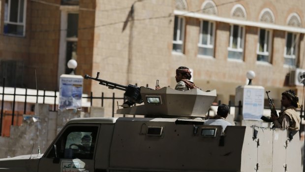 Houthi militiamen near the Saudi and UAE embassies in the Yemeni capital Sanaa.