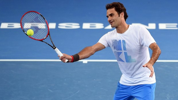 Roger Federer takes part in a practice session ahead of the Brisbane International tennis tournament at the Patrick Rafter Arena in Brisbane on Saturday.