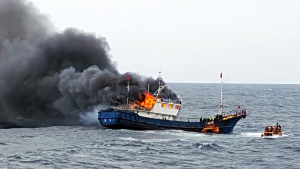 A Chinese fishing boat catches fires during an inspection by the South Korean Mokpo Coast Guard in the water off Hong Island, South Korea. 