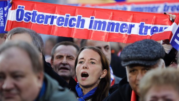 A supporter holds a scarf that reads "Austria always faithful" during the final campaign rally of the far-right Austrian Freedom Party in Vienna in October.