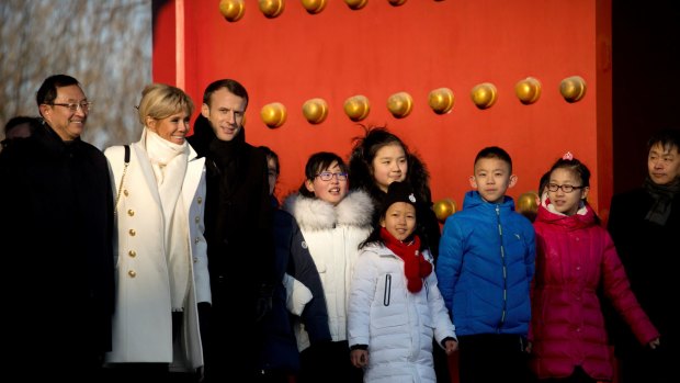 French President Emmanuel Macron and his wife Brigitte Macron visit the Forbidden City in Beijing on January 9.
