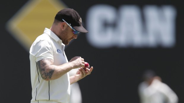 Bent out of shape: Brendon McCullum inspects the ball