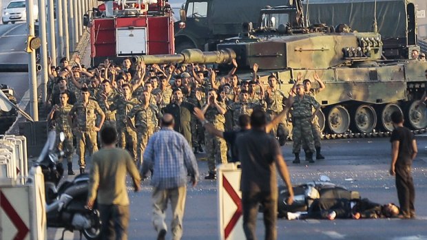 Soldiers involved in the coup attempt surrender on Istanbul's Bosphorus bridge on Saturday.