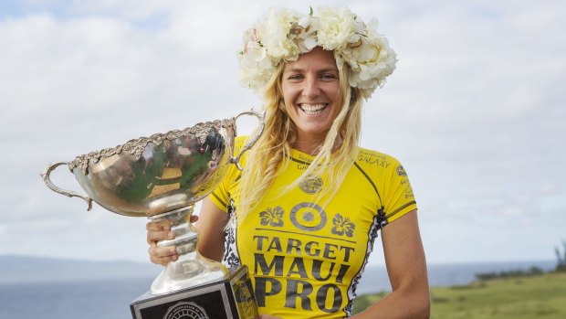Gilmore with her trophy after clinching her sixth ASP World Title at the Target Maui Pro in Hawaii in November 2014.