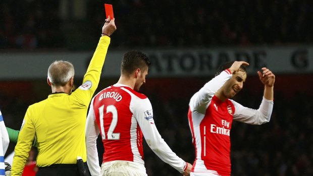 Dismissed: Arsenal's Olivier Giroud is sent off for headbutting QPR's Nedum Onuoha.