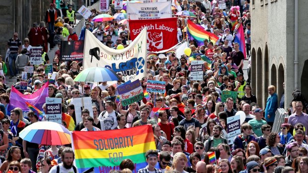 Thousands of people march down Edinburgh's Royal Mile to mark the city's 21st Pride festival - the annual lesbian, gay, bisexual, transgender and intersex (LGBTI) event - last year.