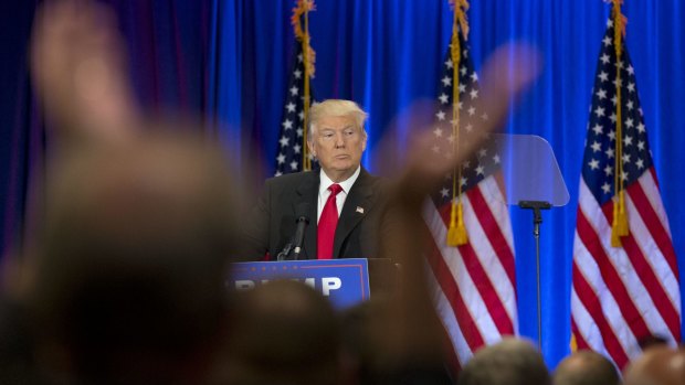 A supporter claps as Republican presidential candidate Donald Trump speaks on Wednesday.