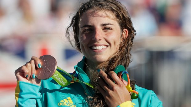 Jessica Fox of Australia holds her bronze medal after the kayak K1 women's final.