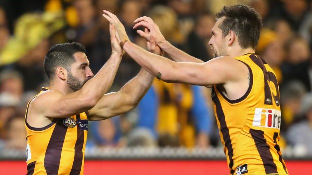 Skipper Luke Hodge celebrates with Paul Puopolo during Friday's semi-final against Adelaide.