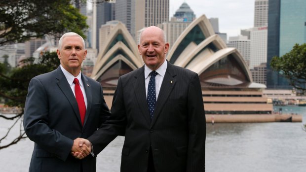 US Vice-President Mike Pence, left, shakes hands with Australia's Governor-General Peter Cosgrove, Her Majesty Queen Elizabeth II's representative to Australia.