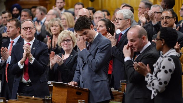 Prime Minister Justin Trudeau wipes his eye while making a formal apology to individuals harmed by the decades-long "gay purge" in Canada.