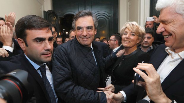 Former French prime minister and candidate for the French right-wing presidential primary Francois Fillon, centre, in Paris. Fillon had the largest share of votes in early returns on Sunday.