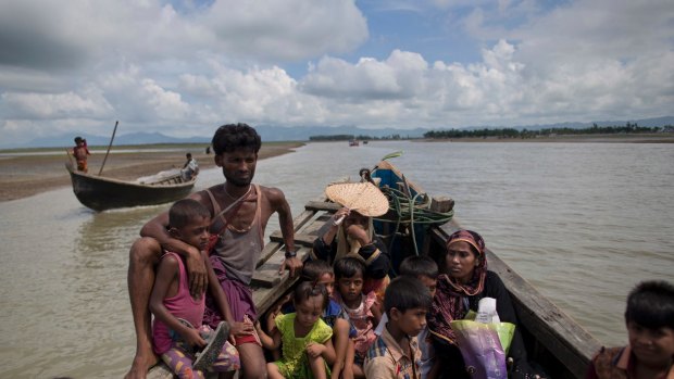 Rohingya Muslims from Myanmar travel in a boat to a camp for refugees in Shahparirdwip, Bangladesh on Monday.