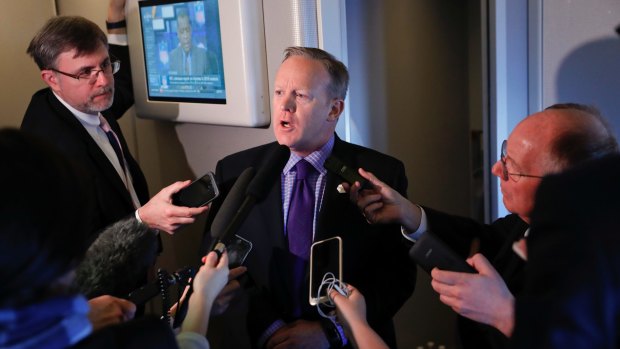 White House press secretary Sean Spicer speaks to reporters on Air Force One en route to Philadelphia. 