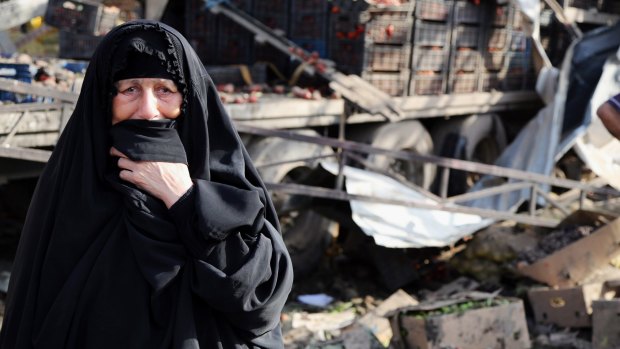 An Iraqi woman grieves at the scene of a bomb attack in Jameela market in Baghdad's crowded Sadr City neighbourhood.