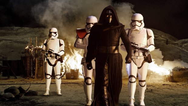 Kylo Ren (Adam Driver) with Stormtroopers in <i>Star Wars: The Force Awakens</i>.