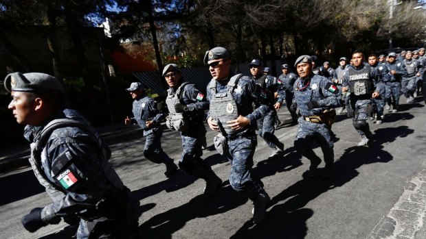 Police officers are deployed near the site of an explosion at a maternity hospital in Mexico City. 