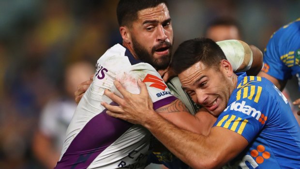The Storm's Jesse Bromwich is tackled by the Eels' Corey Norman.