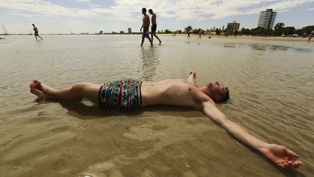 Luke Schult of Rye cools off at St Kilda beach.