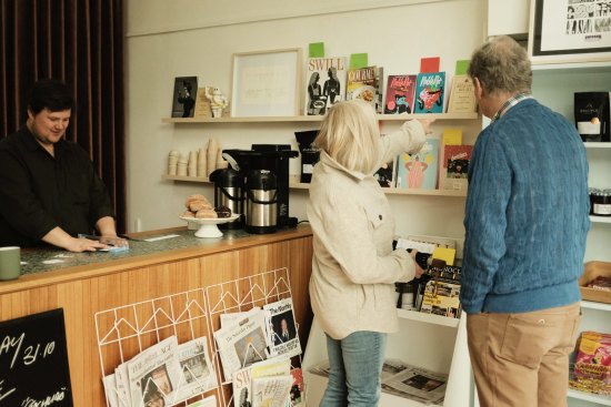 Newspapers and independent magazines join the line-up of pastries and sandwiches at the small shop.