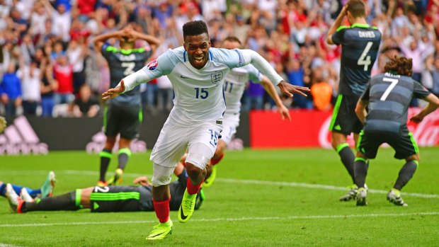 At the death: Daniel Sturridge wheels away in celebration after his late goal against Wales.
