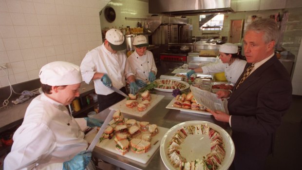 Peter Rowland (right) in the kitchen during a frantic lunch-making session in 1997.