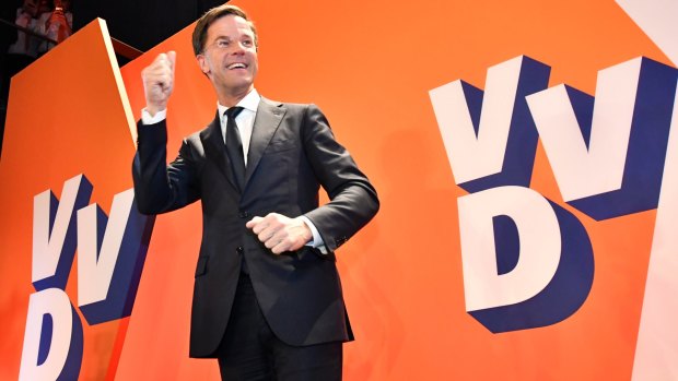 Dutch Prime Minister Mark Rutte of the free-market VVD party celebrates after exit poll results of the parliamentary elections were announced in The Hague.