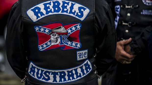 The man phoned triple-0 from his bathroom and said Rebels bikies were in his living room, a court was told.