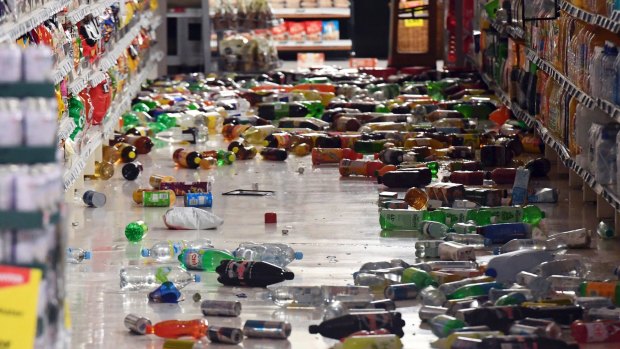Groceries litter the aisle of a Wellington supermarket on Monday after a major earthquake struck New Zealand's south Island.