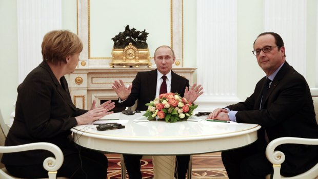 German Chancellor Angela Merkel, Russia's President Vladimir Putin and French President Francois Hollande at the Kremlin.