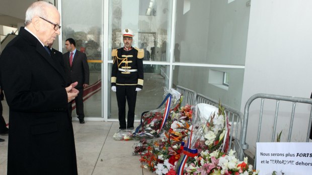 Tunisian's president Beji Caid Essebsi, left,  lays a wreath in memory of the victims of the terrorist attack at the Bardo Museum in Tunis, on Sunday  March 22, 2015.