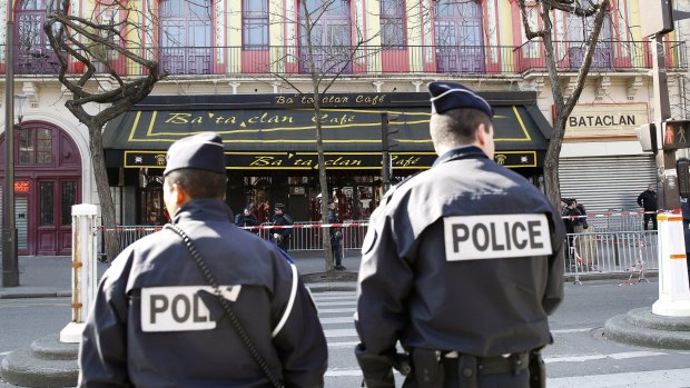 Police officers patrol outside the Bataclan concert hall in Paris after the November 13 attacks.