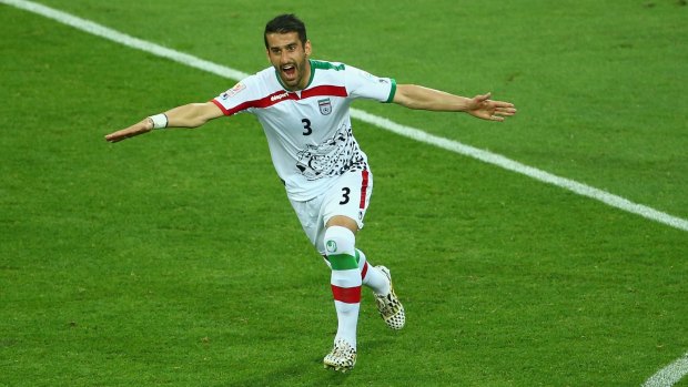 Iran's Ehsan Haji Safi celebrates after he scored his side's first goal against Bahrain on Sunday.