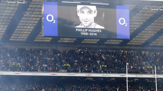 Phillip Hughes' photo is displayed on the scoreboard at Twickenham.
