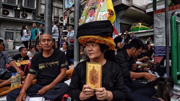 Crowds gather outside Siriraj Hospital in Bangkok on Friday following the king's death.