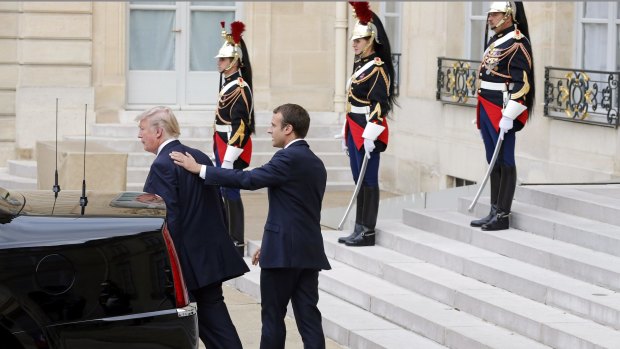 Emmanuel Macron escorts Donald Trump after their meeting at the Elysee Presidential Palace in Paris.