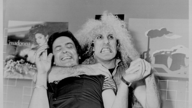 Lead singer Dee Snider of Twisted Sister does a "twist" of sorts with Donnie, November 18, 1984.
