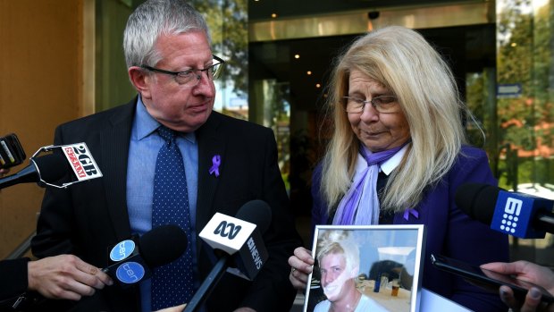 Mark and Faye Leveson with a photograph of their son Matthew Leveson. 