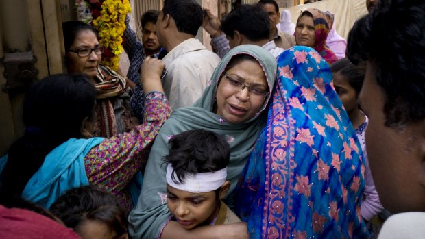 A Pakistani Christian mother holds her injured child who survived Sunday's bombing attack in Lahore.