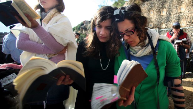 Members of Women of the Wall pray at the Western Wall wearing prayer shawls and phylacteries or prayer boxes, both of which Orthodox Judaism regard as solely for men.