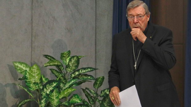 Accused: Cardinal George Pell arrives to meet the media at the Vatican on Thursday.