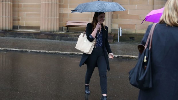 Lucy McNamara attempts to evade the media after Friday's sentencing.