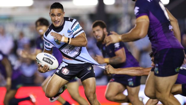 Up and down game: Valentine Holmes breaks the Storm defence.