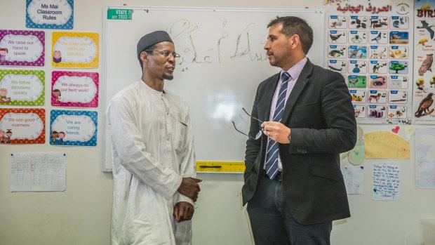 The Islamic School of Canberra is making a plea to the federal government regarding the loss of their funding. Teacher Adama Konda, left, and Principal David Johns