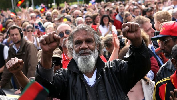Reg Edwards raises his fists in triumph outside Parliament House after watching a live broadcast of Kevin Rudd's apology to the stolen generation. 