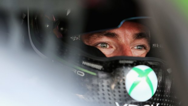 Back at it: Marcos Ambrose sits in his Xbox Racing DJR Ford during practice for the Sydney 500.