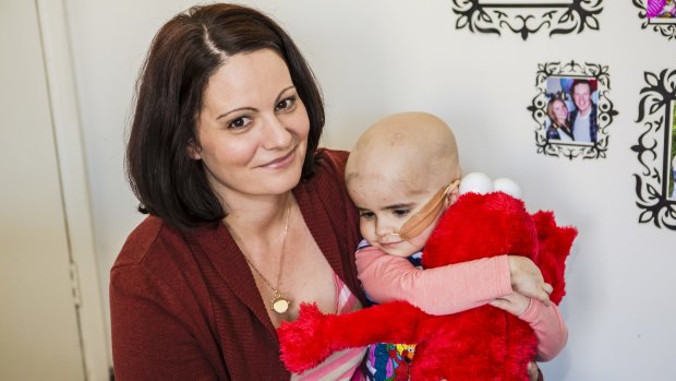 Surrounded by love: Lauren McGuigan and her husband Troy are spending as much time as they can with Annie 3, after doctors said her brain cancer was inoperable.