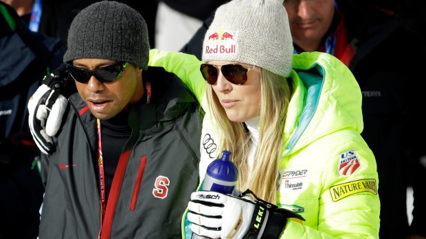 New focus: Tiger Woods, pictured with partner Lindsey Vonn at the Alpine World Ski Championships in Colorado this week.